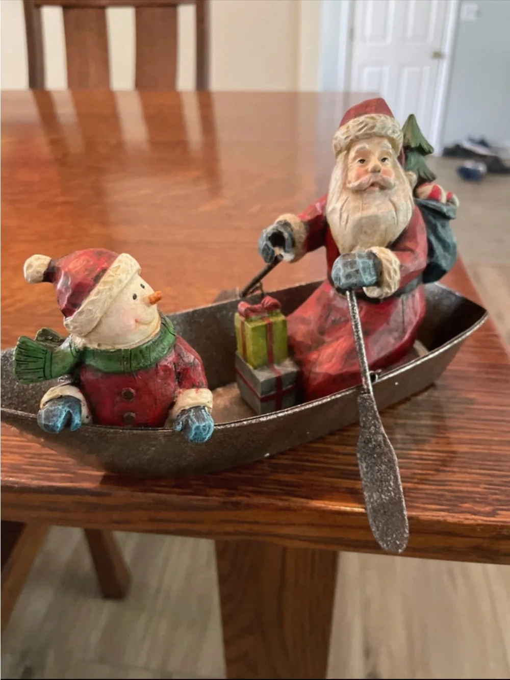 Santa and Snowman in metal fishing boat